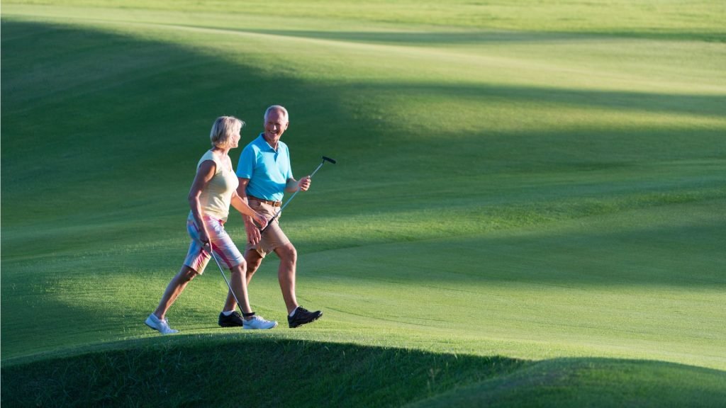 old couple Walking wearing Golf Shoes